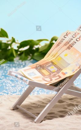 220927_stock-photo-money-on-vacation-pack-of-fifty-euro-bills-sitting-at-the-beach-on-a-sun-lounger-in-front-of-a-279534509